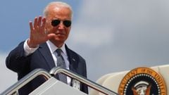 Joe Biden waves to the media as he boards Air Force One at Joint Base Andrews in Maryland, US.