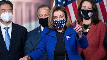 TOPSHOT - US Speaker of the House Nancy Pelosi, with House impeachment managers, speaks to the press after the Senate voted to acquit former US President Donald Trump, in the US Capitol in Washington, DC, on February 13, 2021. - Former US president Donald