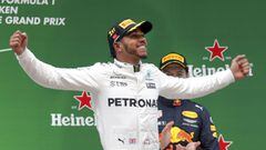 Mercedes driver Lewis Hamilton of Britain celebrates on the podium after winning the Chinese Formula One Grand Prix at the Shanghai International Circuit in Shanghai, China, Sunday, April 9, 2017. (AP Photo/Andy Wong)