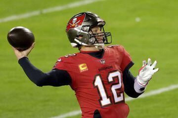 (FILES) In this file photo Quarterback Tom Brady #12 of the Tampa Bay Buccaneers looks to pass against the Washington Football Team during the first half of the NFC Wild Card playoff game at FedExField on January 9, 2021 in Landover, Maryland