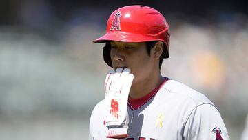 OAKLAND, CALIFORNIA - SEPTEMBER 03: Shohei Ohtani #17 of the Los Angeles Angels with batting gloves in his mouth walks back to the dugout at the end of the top of the first inning against the Oakland Athletics at RingCentral Coliseum on September 03, 2023 in Oakland, California.   Thearon W. Henderson/Getty Images/AFP (Photo by Thearon W. Henderson / GETTY IMAGES NORTH AMERICA / Getty Images via AFP)