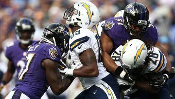 BALTIMORE, MD - NOVEMBER 1: Running back Melvin Gordon #28 of the San Diego Chargers is tackled by inside linebacker Daryl Smith #51 of the Baltimore Ravens while tight end Ladarius Green #89 of the San Diego Chargers blocks tackle De&#039;Ondre Wesley #77 of the Baltimore Ravens in the first quarter of a game at M&amp;T Bank Stadium on November 1, 2015 in Baltimore, Maryland. (Photo by Matt Hazlett/Getty Images)