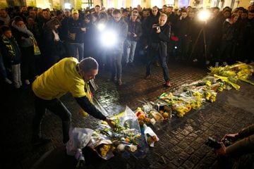 Fans gather near a row of yellow tulips in Nantes' city center after news that newly-signed Cardiff City soccer player Emiliano Sala was missing after the light aircraft he was travelling in disappeared between France and England the previous evening, acc