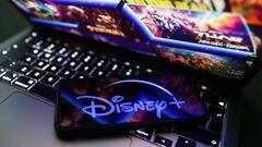 Disney+ logo displayed on a phone screen and Disney+ website displayed on a laptop screen are seen in this illustration photo taken in Krakow, Poland on November 27, 2022. (Photo by Jakub Porzycki/NurPhoto via Getty Images)