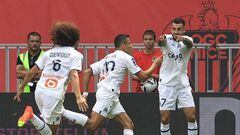 Marseille's Chilean forward Alexis Sanchez (C) celebrates with teammates after scoring a goal during the French L1 football match between OGC Nice and Olympique Marseille (OM) at the Allianz Riviera Stadium in Nice, south-eastern France, on August 28, 2022. (Photo by Valery HACHE / AFP) (Photo by VALERY HACHE/AFP via Getty Images)
