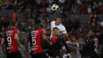 (L-R), Jesus Angulo of Atlas and Juan Dinenno of Pumas during the game Atlas vs Pumas UNAM, corresponding to the Semifinals second leg match of the Torneo Apertura Grita Mexico A21 of the Liga BBVA MX, at Jalisco Stadium, on December 05, 2021.  &lt;br&g