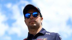 SPIELBERG, AUSTRIA - JULY 08: Sergio Perez of Mexico and Oracle Red Bull Racing walks in the Paddock prior to practice ahead of the F1 Grand Prix of Austria at Red Bull Ring on July 08, 2022 in Spielberg, Austria. (Photo by Clive Rose/Getty Images)
