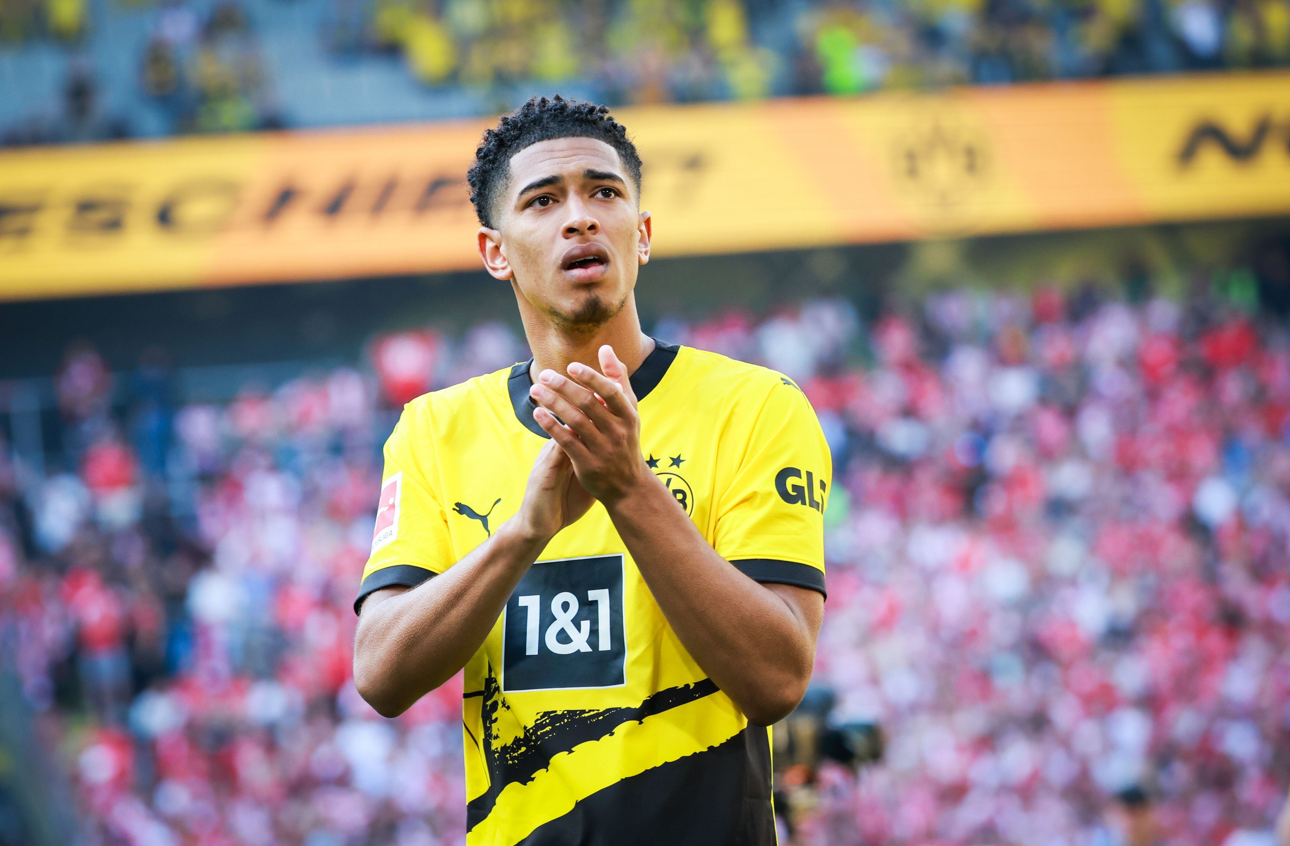 28 May 2023, North Rhine-Westphalia, Dortmund: Soccer: Bundesliga, Matchday 34, Borussia Dortmund - FSV Mainz 05, Signal Iduna Park. Dortmund's Jude Bellingham joins the fans in the South Stand after the match. Photo: Christian Charisius/dpa - IMPORTANT NOTE: In accordance with the requirements of the DFL Deutsche Fußball Liga and the DFB Deutscher Fußball-Bund, it is prohibited to use or have used photographs taken in the stadium and/or of the match in the form of sequence pictures and/or video-like photo series. (Photo by Christian Charisius/picture alliance via Getty Images)