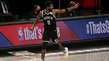 FILE PHOTO: Jun 5, 2021; Brooklyn, New York, USA; Brooklyn Nets point guard Kyrie Irving (11) reacts after a three point shot against the Milwaukee Bucks during the first quarter of game one in the Eastern Conference semifinals of the 2021 NBA Playoffs at