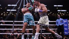 NEW YORK, NEW YORK - JULY 30: Danny Garcia lands a punch on Jose Benavidez Jr. (teal shorts) during their super welterweight boxing match at Barclays Center on July 30, 2022 in in the Brooklyn borough of New York.   Adam Hunger/Getty Images/AFP
== FOR NEWSPAPERS, INTERNET, TELCOS & TELEVISION USE ONLY ==