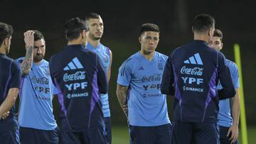 Argentina's (L-R) forward Lionel Messi, midfielder Guido Rodriguez, midfielder Enzo Fernandez and forward Julian Alvarez listen to coach Lionel Scaloni (2nd R) during a training session at Qatar University in Doha, on December 5, 2022 ahead of the Qatar 2022 World Cup quarterfinal football match against Netherlands to be held on December 9 at Lusail stadium. (Photo by JUAN MABROMATA / AFP) (Photo by JUAN MABROMATA/AFP via Getty Images)