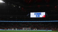 LONDON, ENGLAND - OCTOBER 07: A general view of match action with the scoreboard announcing the attendance at Wembley Stadium of 76,893 fans during the Women's International Friendly match between England and USA at Wembley Stadium on October 7, 2022 in London, England. (Photo by Matthew Ashton - AMA/Getty Images)