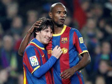 In their day | Barcelona defender Eric Abidal embraces teammate Lionel Messi in 2011.