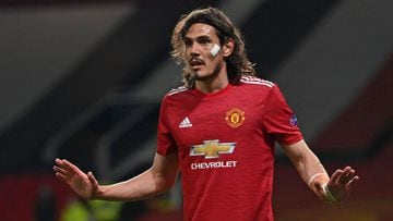 (FILES) In this file photo taken on April 29, 2021 Manchester United&#039;s Uruguayan striker Edinson Cavani gestures during the UEFA Europa League semi-final, first leg football match between Manchester United and Roma at Old Trafford stadium in Manchester, north west England. - Edinson Cavani will remain at Manchester United next season after the on-form Uruguayan signed a one-year contract extension on Monday, May 10. (Photo by Paul ELLIS / AFP)