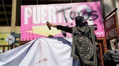 A demonstrator makes graffiti during a protest against the return of bullfighting, outside the Plaza de Toros Mexico bullfighting ring, in Mexico City, Mexico, January 28, 2024. REUTERS/Toya Sarno Jordan