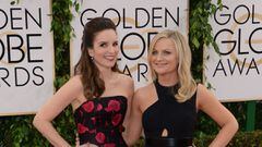 (FILES) In this file photo taken on February 01, 2021 this January 12, 2014 photo shows actress Tina Fey (L) and Amy Poehler (R) arriving for the 71st Golden Globe Awards held at the Beverly Hilton hotel in Beverly Hills. - Hollywood&#039;s awards season 