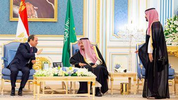 A handout picture provided by the Saudi Media Ministry on March 8, 2022 shows Saudi Arabia&#039;s King Salman Abdulaziz (C) and Crown Prince Mohammed bin Salman (R) receiving Egyptian President Abdel Fattah al-Sisi in Riyadh.