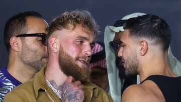 US boxers Jake Paul (L) and Tommy Fury (R) face off during a press conference in Riyadh on February 23, 2023, ahead of their boxing match. (Photo by Fayez Nureldine / AFP)