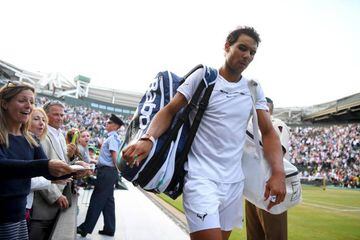Nadal looks dejected after defeat to Müller on Court One.