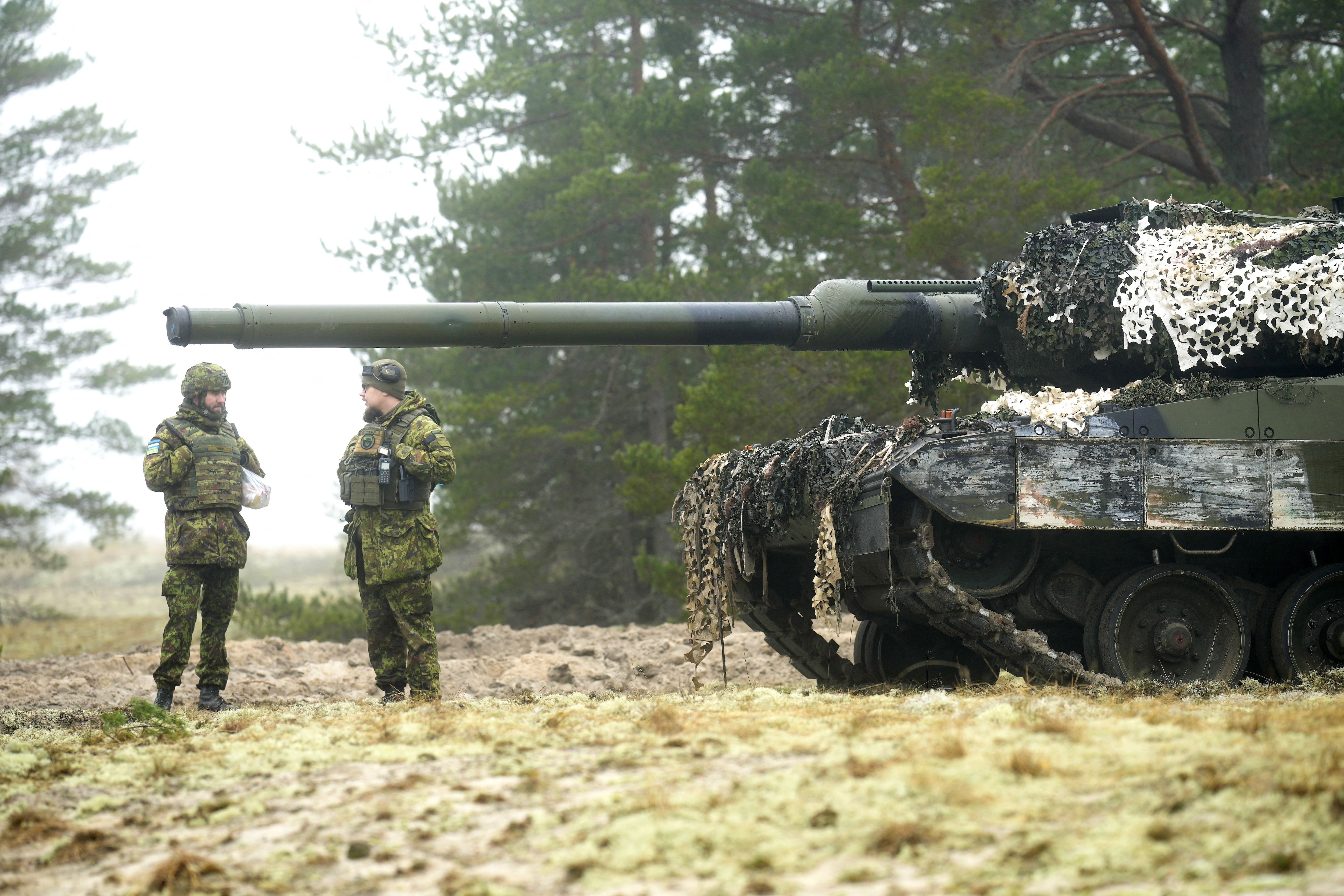 Estonian army servicemen guard their CV-90 infantry fighting vehicle during live fire exercise in Perakula, Estonia February 15, 2023. REUTERS/Ints Kalnins