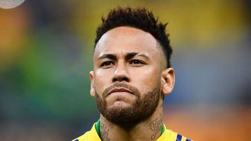 (FILES) In this file photo taken on June 06, 2019 Brazil&#039;s Neymar warms up before a friendly football match against Qatar at the Mane Garrincha stadium in Brasilia ahead of Brazil 2019 Copa America. - Neymar is ready to cut his salary by 12 million euros to leave Paris Saint-Germain as part of a &quot;verbal agreement&quot; reached between the Brazilian and Barcelona, according to reports in the Spanish press released on June 25, 2019. (Photo by EVARISTO SA / AFP)
