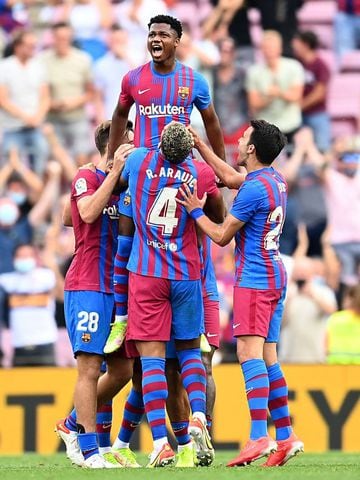 BARCELONA, SPAIN - SEPTEMBER 26: Ansu Fati of FC Barcelona celebrates with Ronald Araujo after scoring their side's third goal during the LaLiga Santander match between FC Barcelona and Levante UD at Camp Nou on September 26, 2021 in Barcelona, Spain. (Ph