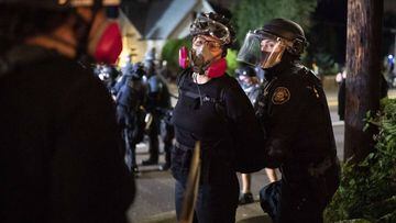 A protester is arrested by a Portland police officer on August 30, 2020 in Portland, Oregon.
