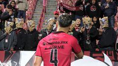 Tijuana's Chilean defender #04 Nicolas Diaz reacts at Tijuana's fans protesting the team's performance and covering their heads with paper bags at the end of the Mexican Clausura tournament football match between Tijuana and Monterrey at Caliente stadium in Tijuana, Baja California state, Mexico, on February 28, 2024. (Photo by Guillermo Arias / AFP)
