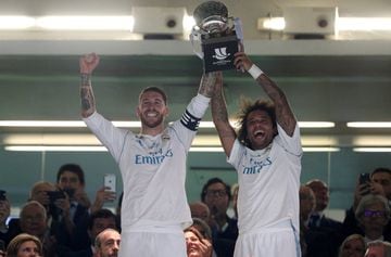 Sergio Ramos and Marcelo lift the Super Copa trophy