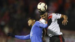 Robert Rojas, of Argentina's River Plate, right, and Pedro Rocha of Brazil's Cruzeiro compete for the ball during a Copa Libertadores soccer match in Buenos Aires, Argentina, Tuesday, July 23, 2019. (AP Photo/Natacha Pisarenko)