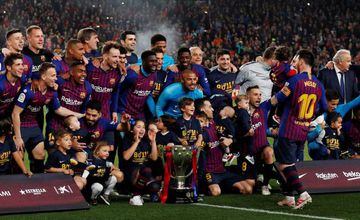 Barcelona celebrate winning La Liga with the trophy