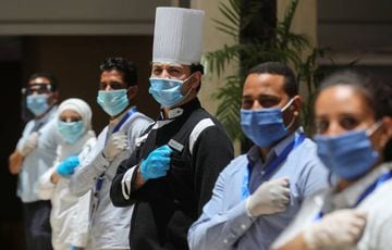 Employees of the Hilton Hurghada Plaza wear face masks amid the coronavirus disease (COVID-19) outbreak, at Hilton Hurghada Plaza