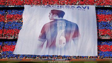 FILE PHOTO: Supporters display a giant banner of Barcelona&#039;s Xavi Hernandez during their Spanish first division soccer match against Deportivo de la Coruna at Camp Nou stadium in Barcelona, Spain, May 23, 2015. Xavi announced on Thursday his retireme