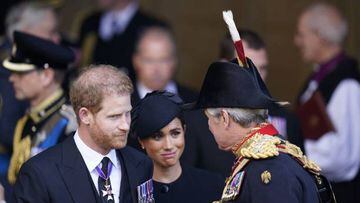 Britain's Prince Harry (L), Duke of Sussex, and Meghan (C), Duchess of Sussex, leave after paying their respects at Westminster Hall, at the Palace of Westminster, where the coffin of Queen Elizabeth II, will Lie in State on a Catafalque, in London on September 14, 2022. - Queen Elizabeth II will lie in state in Westminster Hall inside the Palace of Westminster, from Wednesday until a few hours before her funeral on Monday, with huge queues expected to file past her coffin to pay their respects. (Photo by Danny Lawson / POOL / AFP) (Photo by DANNY LAWSON/POOL/AFP via Getty Images)