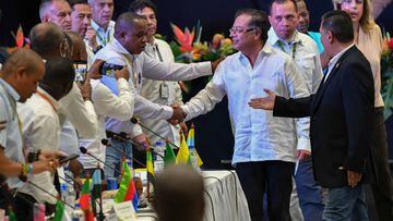 Colombian President Gustavo Petro shakes hands with mayors during the first Summit of Mayors from the Colombian Pacific Coast region, in Yumbo, Colombia on August 10, 2022. (Photo by JOAQUIN SARMIENTO / AFP) (Photo by JOAQUIN SARMIENTO/AFP via Getty Images)