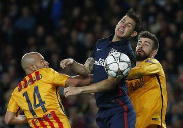 Barcelona's Javier Mascherano and Gerard Pique go for the sandwich approach with Atletico Madrid's Lucas Hernandez