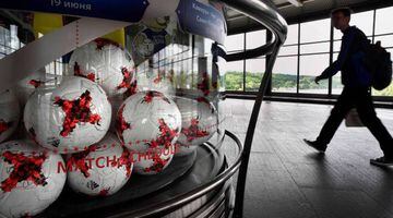 A man walks by an exhibition devoted to the FIFA Confederations Cup football tournament and Football world Cup 2018 on a platform of a Vorobyovy Hill metro station in Moscow on June 14, 2017.