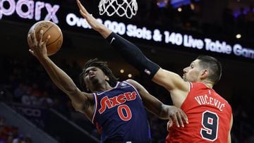 PHILADELPHIA, PENNSYLVANIA - NOVEMBER 03: Tyrese Maxey #0 of the Philadelphia 76ers shoots a lay up under Nikola Vucevic #9 of the Chicago Bulls during the fourth quarter at Wells Fargo Center on November 03, 2021 in Philadelphia, Pennsylvania. NOTE TO US