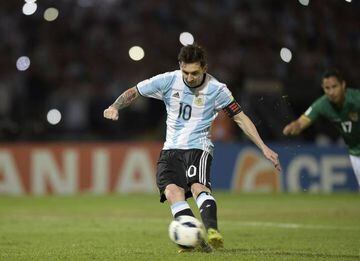 Argentina's Lionel Messi takes a penalty to score against Bolivia
