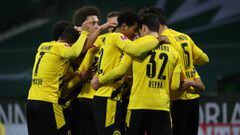 BREMEN, GERMANY - DECEMBER 15: Raphael Guerreiro of Borussia Dortmund (obscured) celebrates with teammates after scoring their team&#039;s first goal during the Bundesliga match between SV Werder Bremen and Borussia Dortmund at Wohninvest Weserstadion on December 15, 2020 in Bremen, Germany. Sporting stadiums around Germany remain under strict restrictions due to the Coronavirus Pandemic as Government social distancing laws prohibit fans inside venues resulting in games being played behind closed doors.  (Photo by Focke Strangmann - Pool/Getty Images)