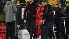 DORTMUND - Alphonso Davies of FC Bayern Munich leaves the field injured during the Bundesliga match between Borussia Dortmund and FC Bayern Munich at Signal Iduna park on October 8, 2022 in Dortmund, Germany. ANP | Dutch Height | GERRIT FROM COLOGNE (Photo by ANP via Getty Images)
