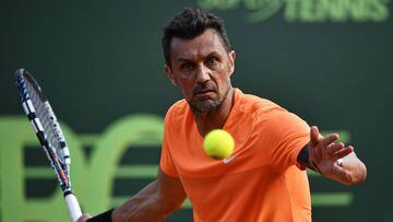 AC Milan&#039;s former player Paolo Maldini returns the ball during the men&#039;s doubles tennis match, with his partner Stefano Landonio against Poland&#039;s player Tomasz Bednarek and Nederland&#039;s player David Pel during the ATP Challenger Tour on