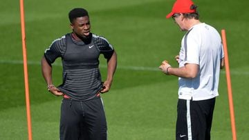 Laurent Blanc (R) chatting to Serge Aurier in training.