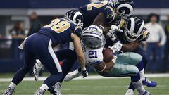 Los Angeles Rams safety Cody Davis (38), Alec Ogletree, top, and Robert Quinn, right, combine to stop Dallas Cowboys running back Ezekiel Elliott (21) in the first half of an NFL football game, Sunday, Oct. 1, 2017, in Arlington, Texas. (AP Photo/Ron Jenkins)