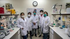 Peruvian biologist Edward Malaga and his team pose for a picture at the Neurobiology Laboratory of the Cayetano Heredia University in Lima, on June 27, 2020. - A group of Peruvian scientists designed a molecular test to detect the COVID-19 coronavirus in just 40 minutes, one of the researchers reported. (Photo by ERNESTO BENAVIDES / AFP)