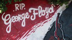This view shows a detail of a mural memorial in Nantes, western France on June 2, 2020, made in memory of the late George Floyd - a week after the death in the Minneapolis of the unarmed black man who was killed when a white police officer knelt on his ne