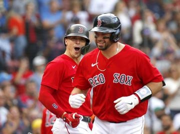 BOSTON, MA - SEPTEMBER 25: Enrique Hernandez #5 of the Boston Red Sox (L) reacts with teammate Kevin Plawecki #25, who connected for a home run against the New York Yankees in the third inning at Fenway Park on September 25, 2021 in Boston, Massachusetts.