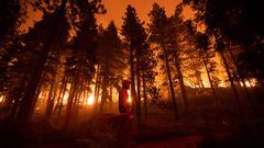 Wildfires continue to threaten the west coast of the United States with strong winds spreading the blaze to Lake Tahoe and spurring widespread evacuations.