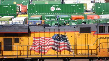 LOS ANGELES, CALIFORNIA - NOVEMBER 21: A freight train engine (BOTTOM) and shipping containers are viewed in a Union Pacific Intermodal Terminal rail yard on November 21, 2022 in Los Angeles, California. A national rail strike could occur as soon as December 5 after the nation’s largest freight rail union, SMART Transportation Division, voted to reject the Biden administration’s contract deal. About 30 percent of the nation’s freight is moved by rail with the Association of American Railroads estimating that a nationwide shutdown could cause $2 billion a day in economic losses. (Photo by Mario Tama/Getty Images)