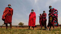 Maasai elders, wearing traditional costumes, with face masks on, due to the coronavirus disease (COVID-19) outbreak, gather at their homestead within the Orboma Manyatta in Sekenani, near the Maasai Mara game reserve in Narok County, Kenya August 10, 2020